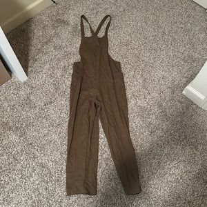 Army green overalls/jumpsuit with pockets.